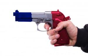 Pistol with french flag pattern in hand