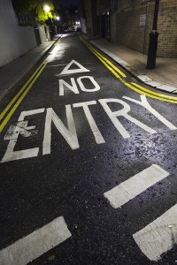 Lane with 'no entry' painted on it