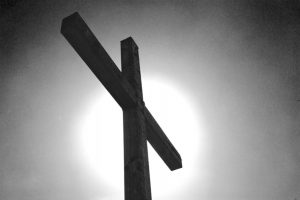 Black and white cross with sun