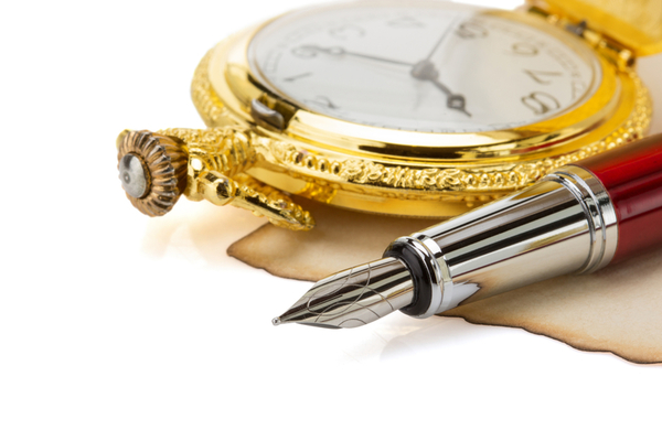 Gold watch with pen